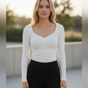 Paige Women's Annalisa top, a white, long-sleeve, ribbed top featuring a sweethe